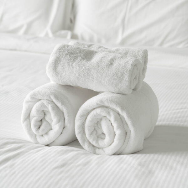 White towel on bed decoration in bedroom interior